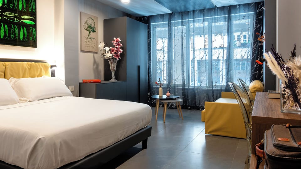 Superior Quadruple Room, City View | In-room safe, laptop workspace, blackout drapes, free WiFi