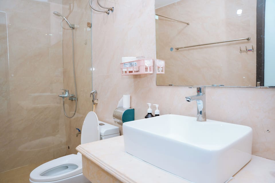 Deluxe Room, Multiple Beds, Balcony, City View | Bathroom | Hair dryer, towels, soap, shampoo