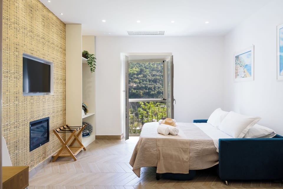 Deluxe Quadruple Room, Balcony, Hill View | Laptop workspace, iron/ironing board, free WiFi