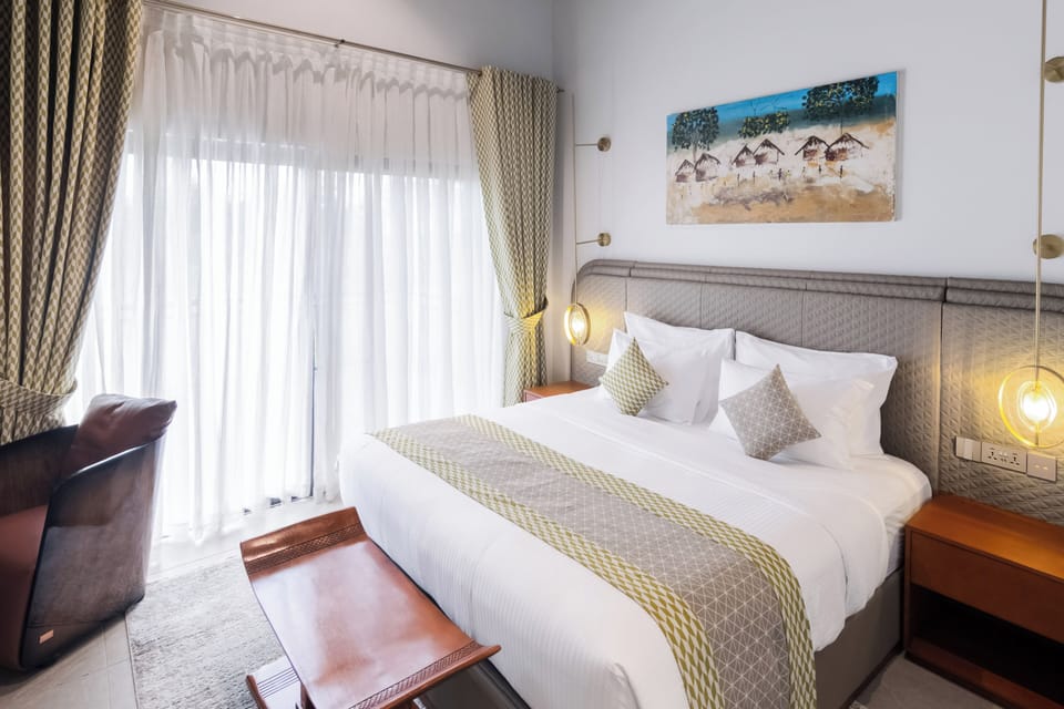 Deluxe Bungalow, Balcony, Garden View | In-room safe, blackout drapes, iron/ironing board, WiFi (free)
