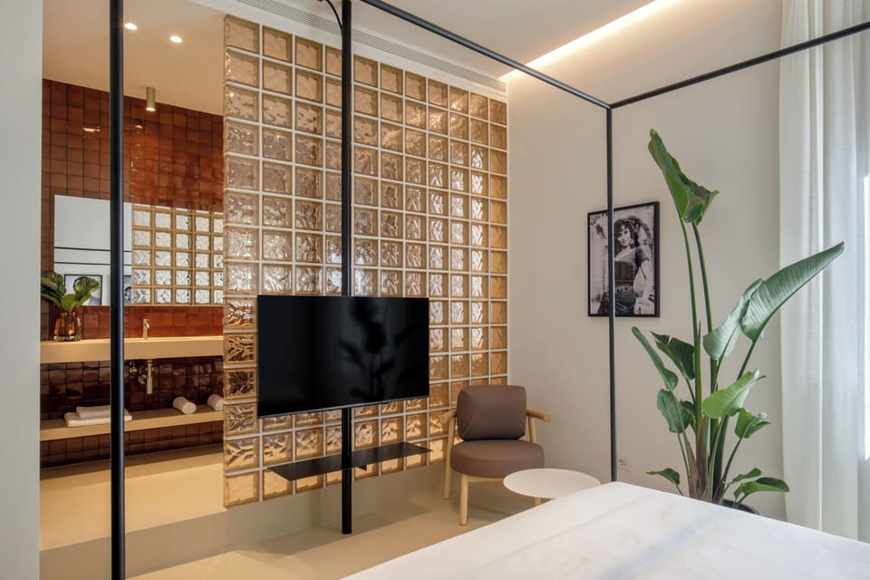 Deluxe Double Room, Courtyard View | Desk, laptop workspace, soundproofing, iron/ironing board