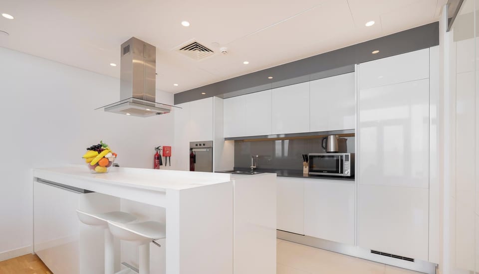 Luxury Apartment, Balcony, Sea View | Private kitchen | Electric kettle, toaster oven, freezer, dining table