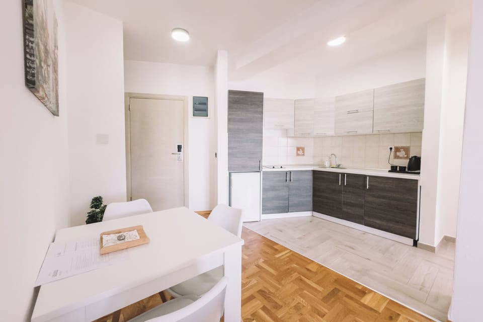 Deluxe Apartment, 2 Bedrooms, Balcony, Beach View | Private kitchen | Electric kettle, highchair