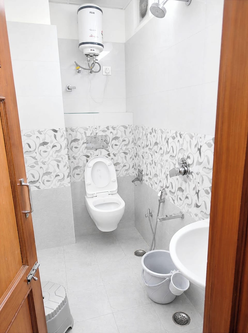 Shower, rainfall showerhead, slippers, towels