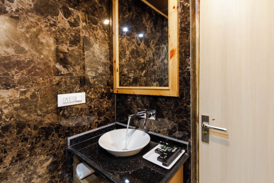 Family Suite, Courtyard View | Bathroom | Shower, hair dryer, towels, soap