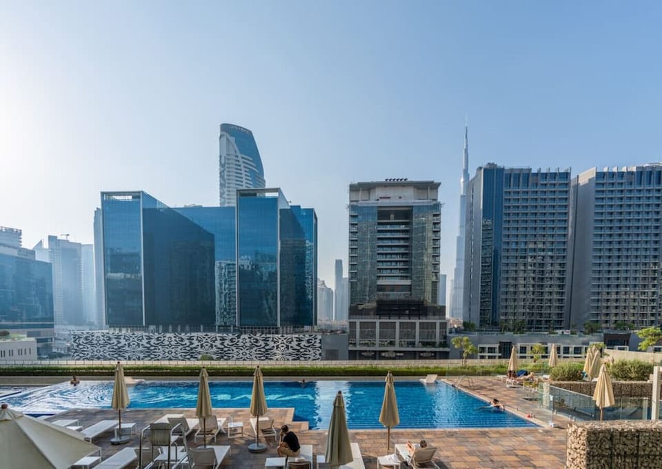2 outdoor pools, open 8:00 AM to 10:00 PM, pool umbrellas, sun loungers