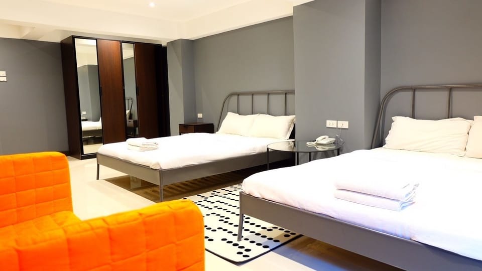 Family Room, 2 Double Beds | In-room safe, desk, free WiFi, bed sheets