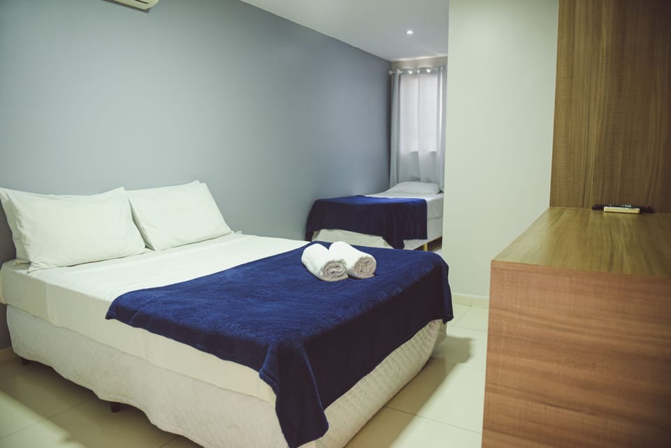 Standard Triple Room | Minibar, individually decorated, blackout drapes, free WiFi