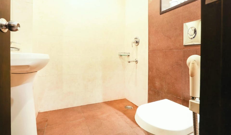 Shower, rainfall showerhead, slippers, towels