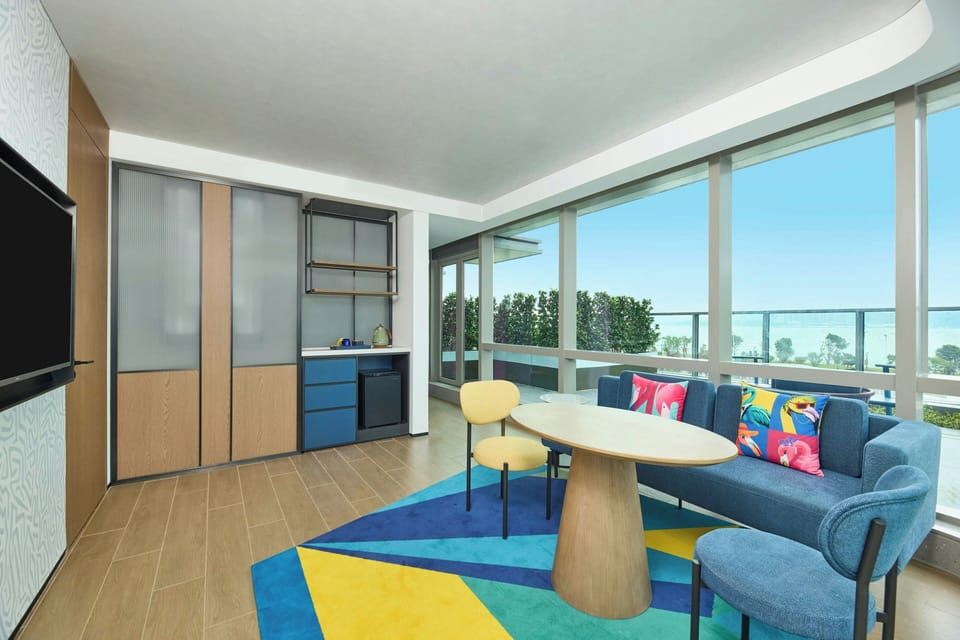 Suite, 1 King Bed, Terrace, Partial Sea View | Living area | 32-inch LED TV with cable channels