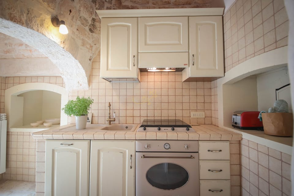 Villa (1 Bedroom) | Private kitchen | Oven, espresso maker, electric kettle, highchair