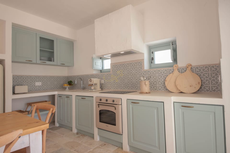Villa (4 Bedrooms) | Private kitchen | Oven, espresso maker, electric kettle, highchair