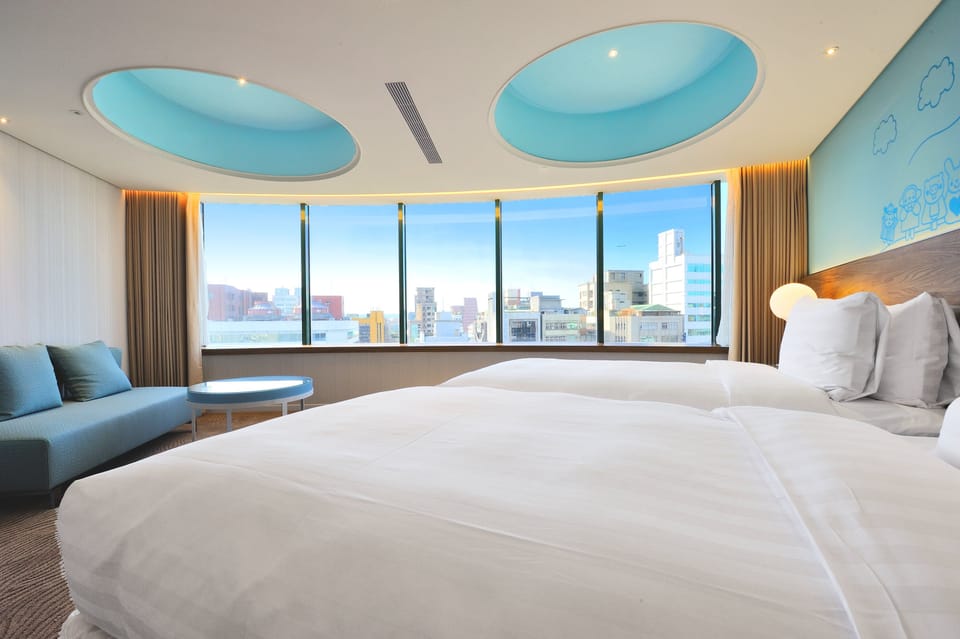 Deluxe Double or Twin Room, City View | Down comforters, in-room safe, desk, iron/ironing board
