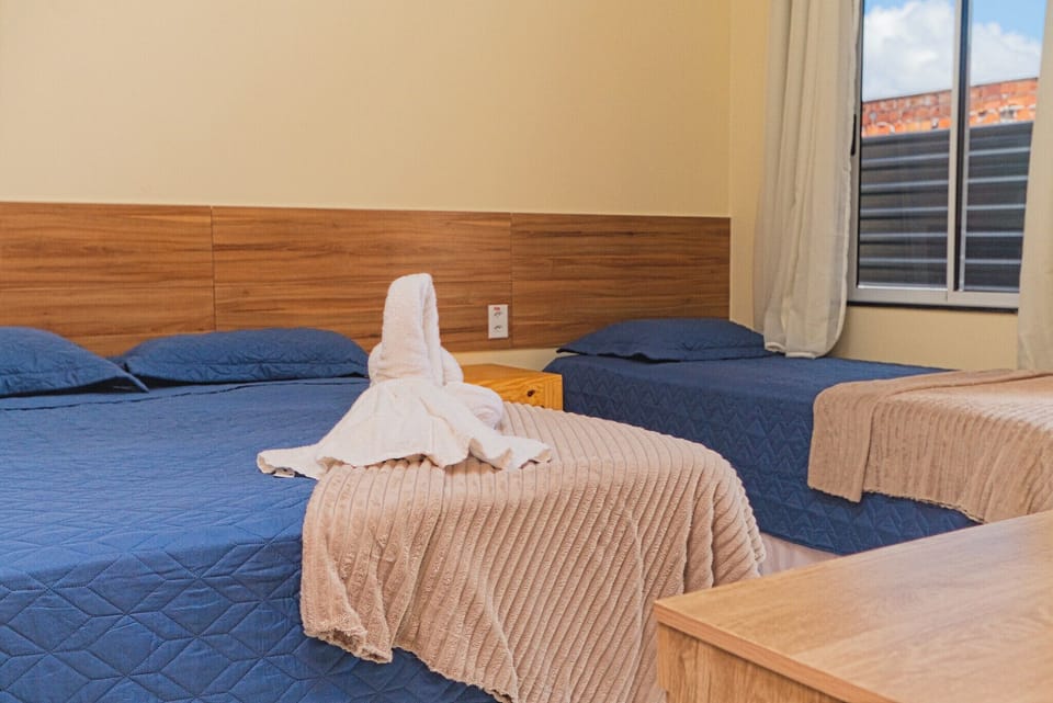 Basic Triple Room | Blackout drapes, iron/ironing board (on request), WiFi (free)