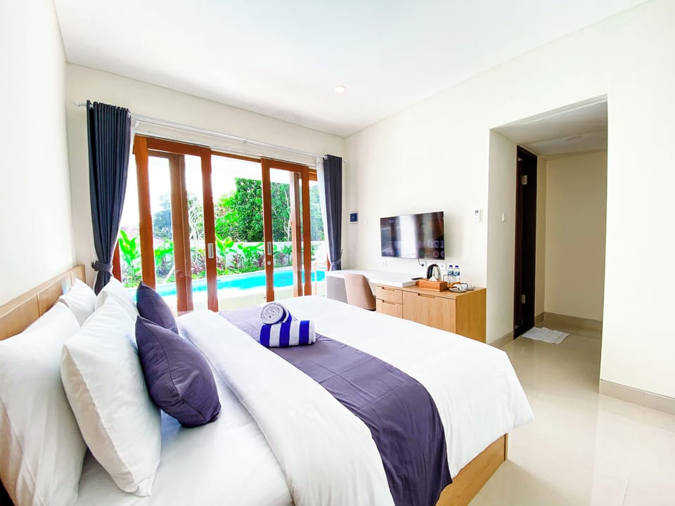 Deluxe Double Room, Pool View | Desk, laptop workspace, free WiFi
