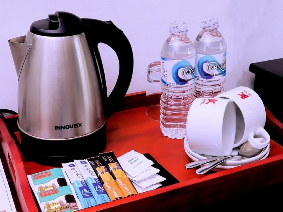 Deluxe Triple Room, Balcony, Garden View | Coffee and/or coffee maker
