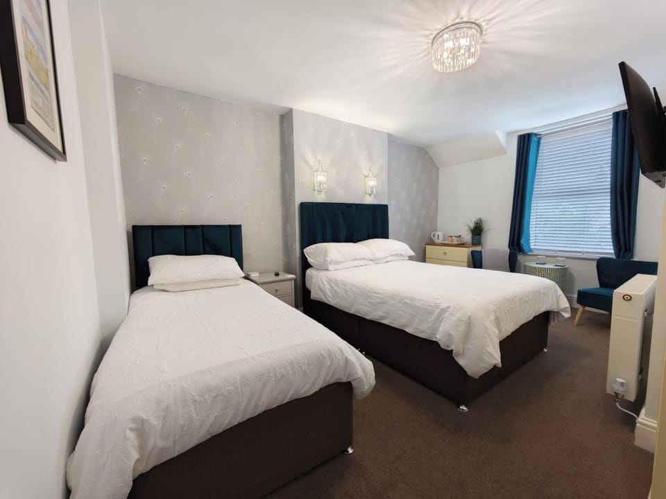 Family Triple Room, Multiple Beds, Non Smoking, Mountain View | Blackout drapes, iron/ironing board (on request), WiFi (free)