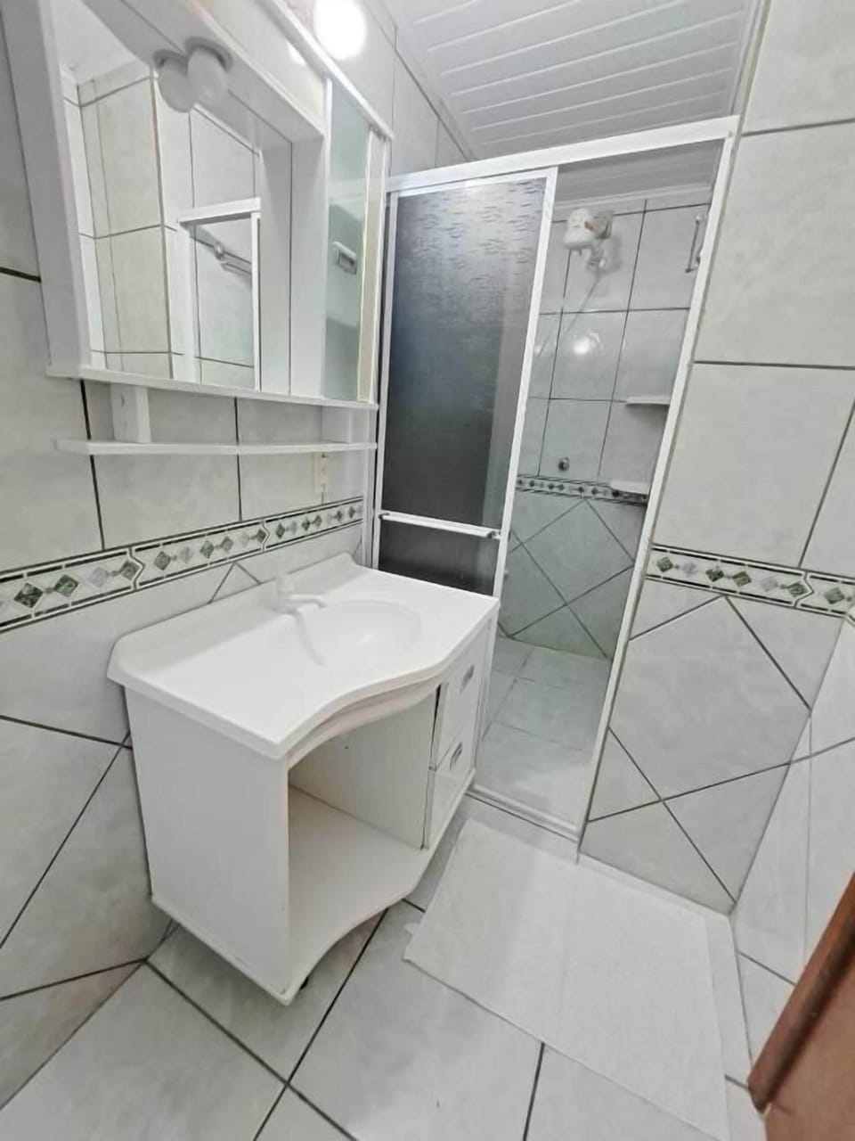 Combined shower/tub, hair dryer, towels, toilet paper
