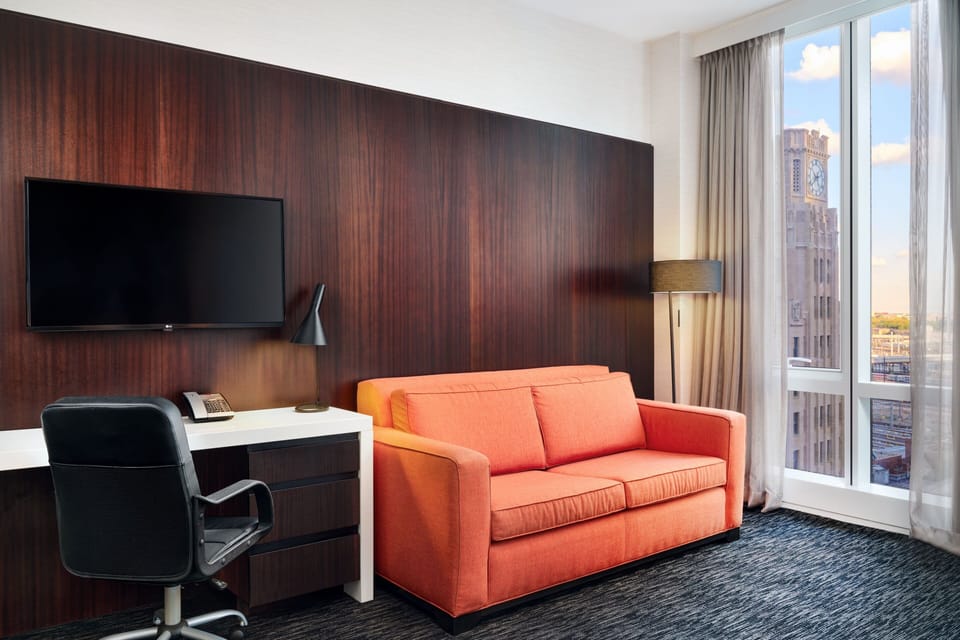 Family Room, 2 Queen Beds, Corner | In-room safe, desk, iron/ironing board, free cribs/infant beds