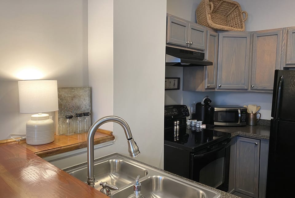 Room, 1 Queen Bed (The Lucile) | Private kitchen | Coffee/tea maker