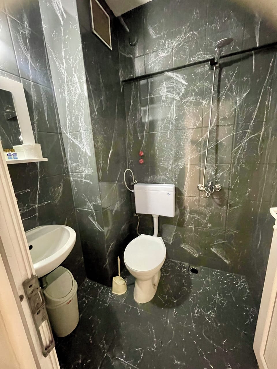 Economy Triple Room, Balcony, Beach View | Bathroom | Shower, hair dryer, towels, soap
