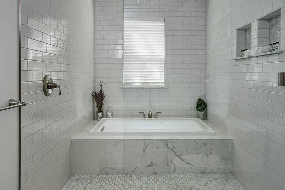 Shower, designer toiletries, towels