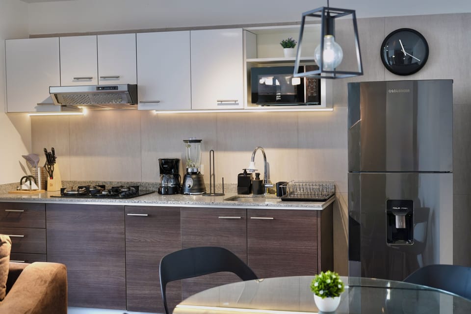 Business Suite, City View | Private kitchen | Full-size fridge, microwave, stovetop, cookware/dishes/utensils