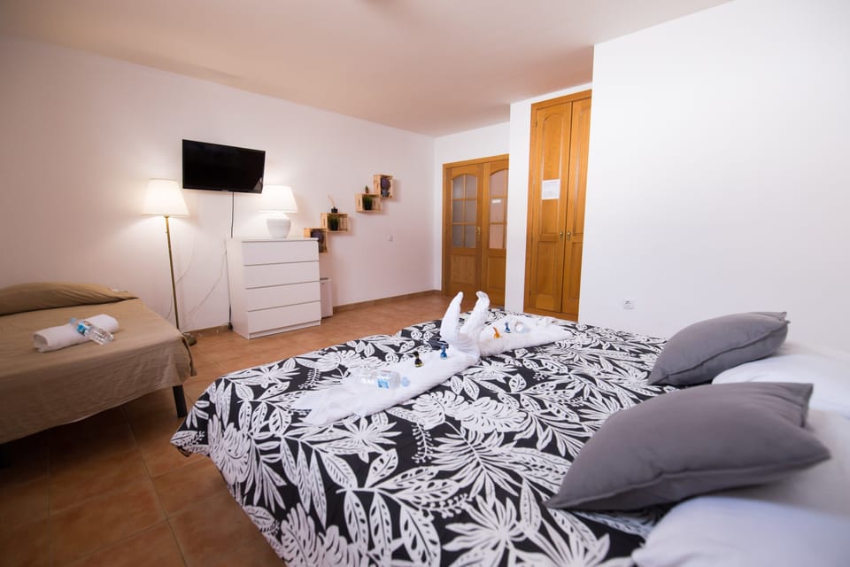 Family Room, Shared Bathroom | Down comforters, free WiFi, bed sheets