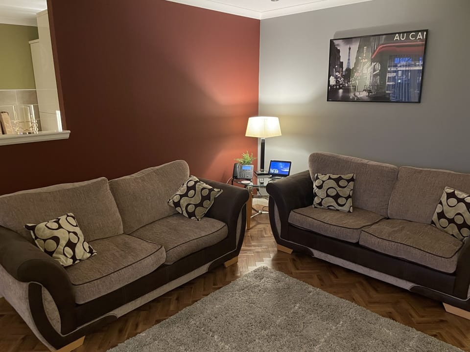 Deluxe Apartment | Living area | LED TV, iPod dock