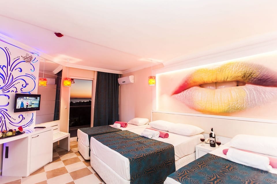 Standard Double Room, Women only, Balcony, Pool View | Minibar, desk, laptop workspace, iron/ironing board