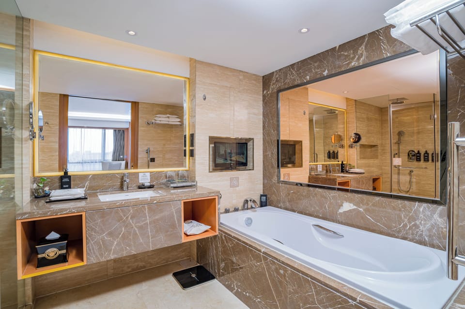 Superior Suite, 1 Queen Bed with Sofa bed, City View | Bathroom | Free toiletries, hair dryer, bathrobes, slippers