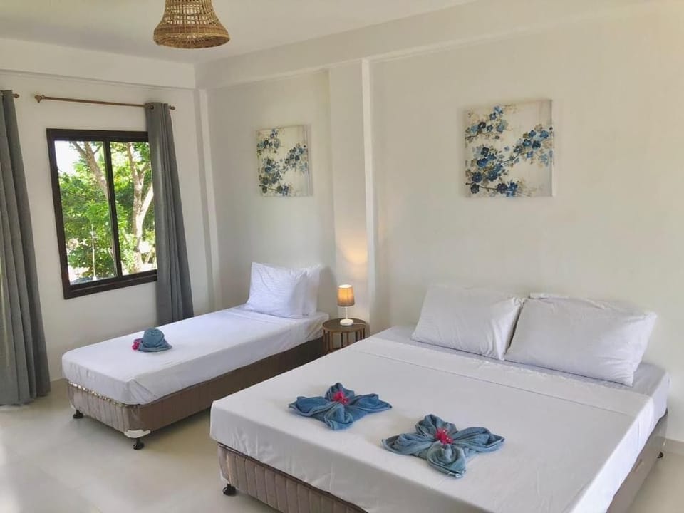 Standard Triple Room, Partial Sea View | In-room safe, desk, blackout drapes, free WiFi