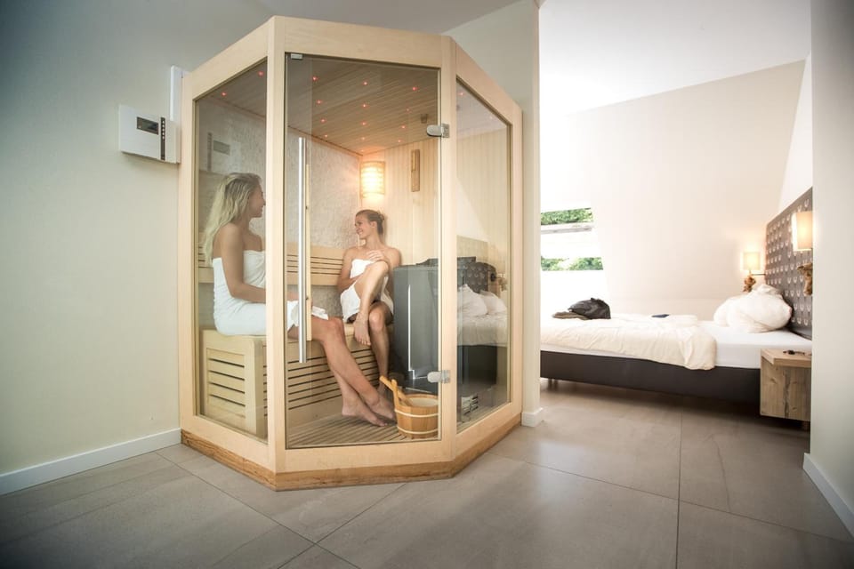 Junior Suite, 1 Bedroom, Sauna | Hypo-allergenic bedding, in-room safe, desk, blackout drapes