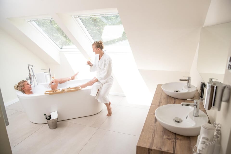 Junior Suite, 1 Bedroom, Sauna | Bathroom | Eco-friendly toiletries, hair dryer, bathrobes, slippers