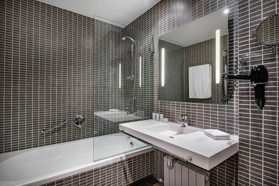 Designer toiletries, hair dryer, bidet, towels