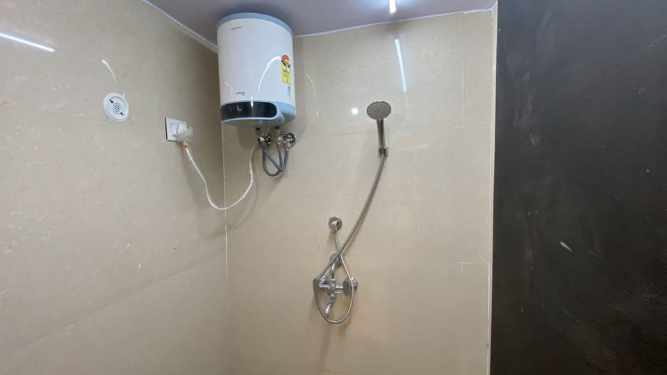 Deluxe Room With Non Attached Private Washroom | Bathroom | Shower, towels, soap, shampoo