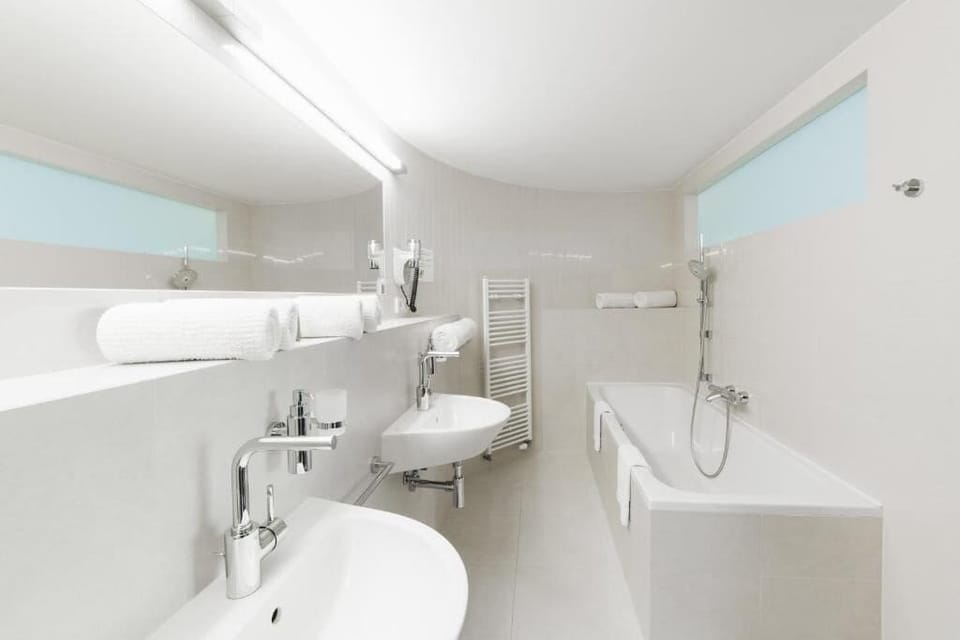 Bathtub, hair dryer, towels