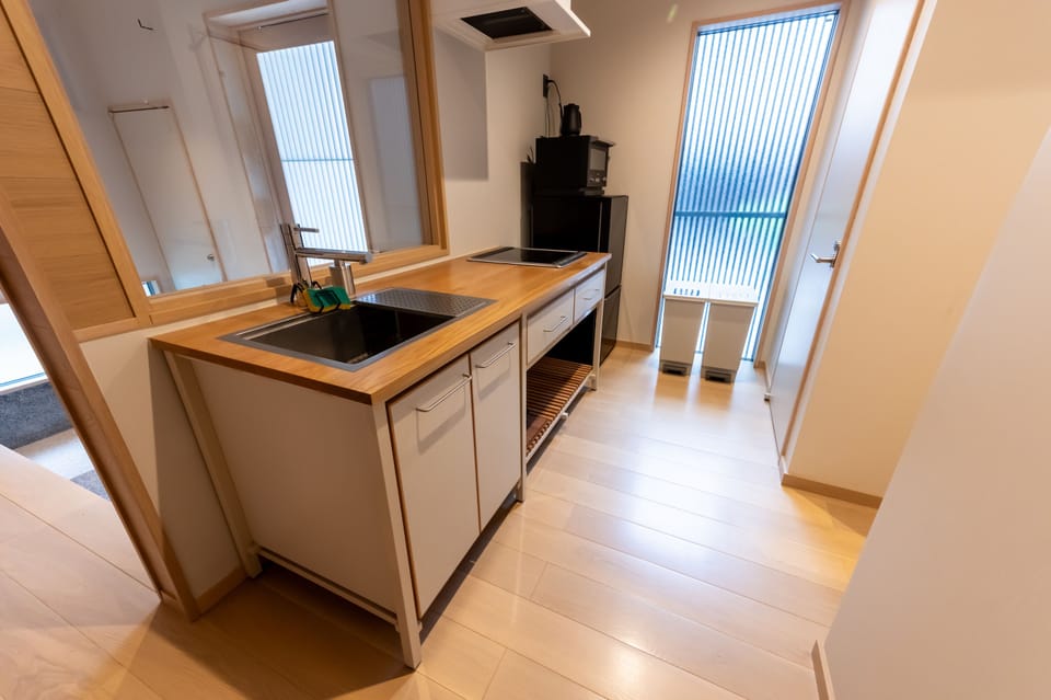 Villa | Private kitchen | Full-size fridge, microwave, cookware/dishes/utensils