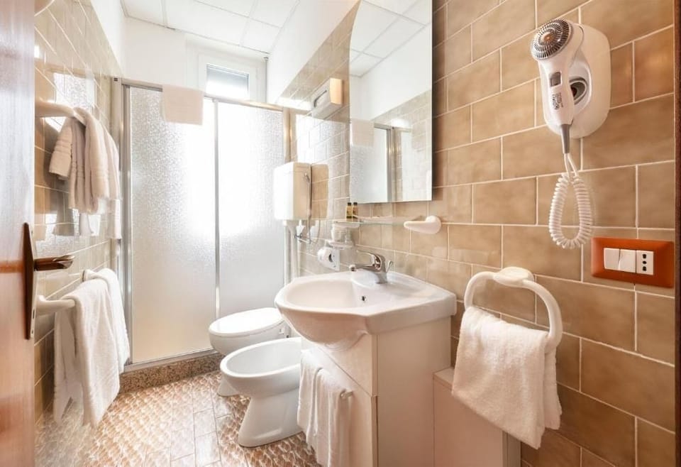 Quadruple Room, Garden View | Bathroom | Shower, hair dryer, towels, soap