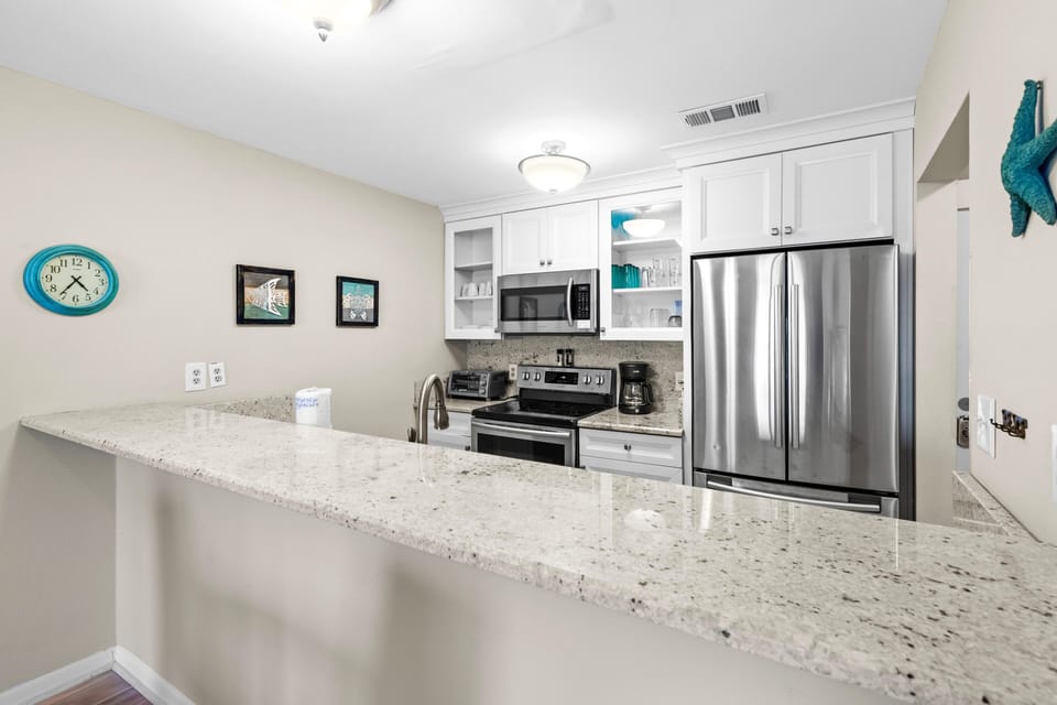 Condo, 1 Queen Bed with Sofa bed (Tradewinds Condominium #25) | Private kitchen | Oven, toaster