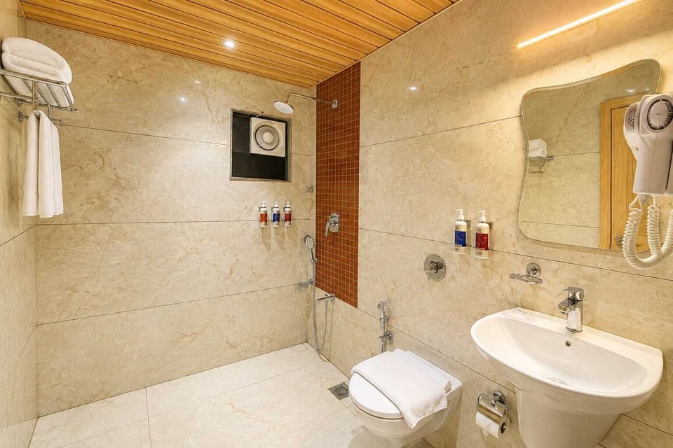 Shower, hair dryer, towels, shampoo