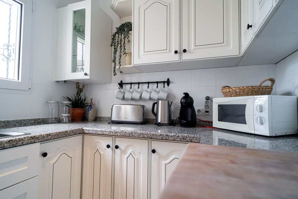 Coffee/tea maker, microwave, cookware/dishes/utensils