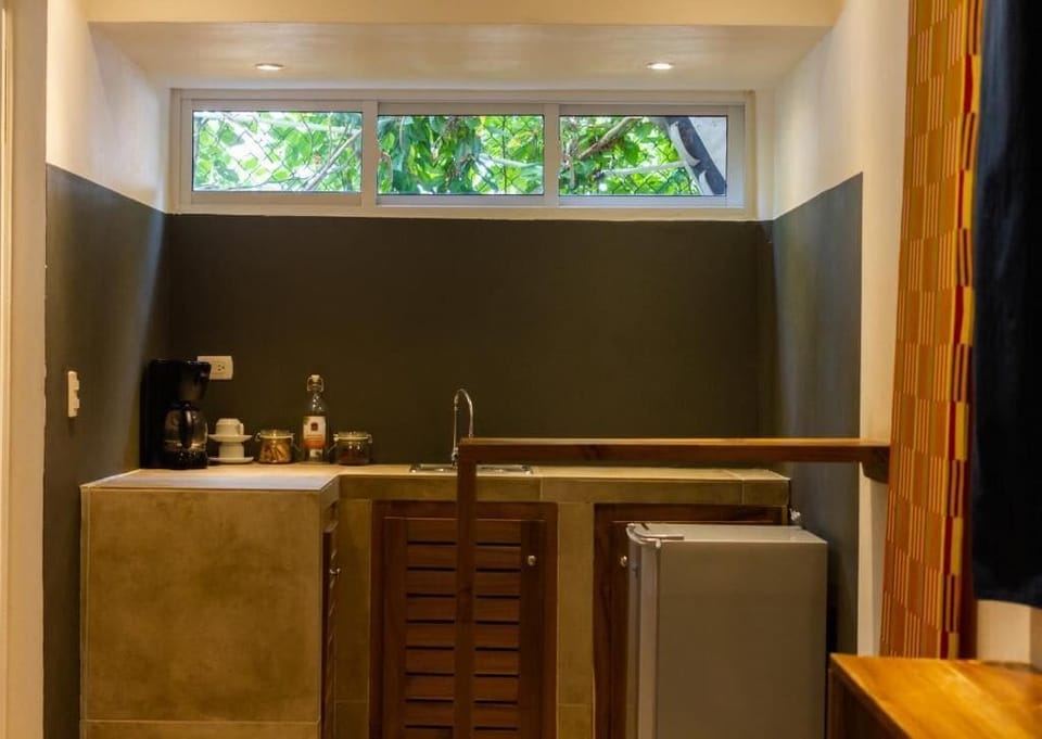 Deluxe Quadruple Room, Balcony | Private kitchen