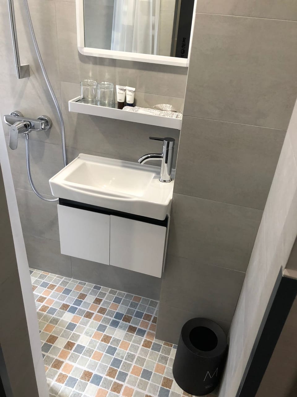 Shower, hair dryer, slippers, towels