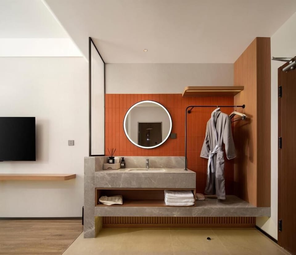 Family Triple Room, Courtyard View | Bathroom | Bathrobes, slippers
