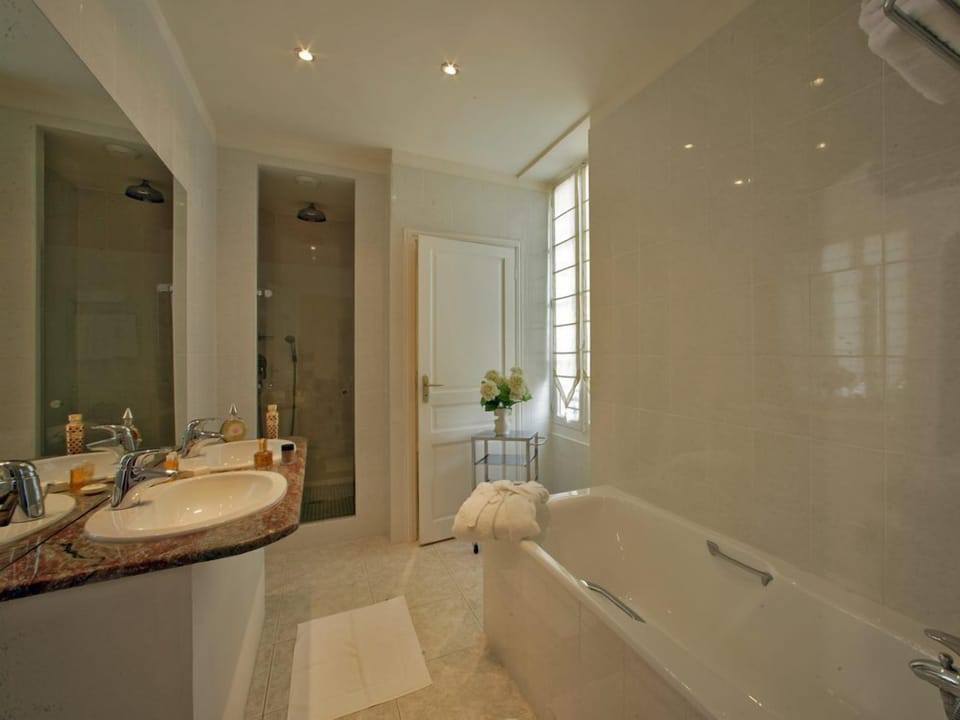 Comfort Suite (For 3) | Bathroom | Separate tub and shower, rainfall showerhead, hair dryer, slippers