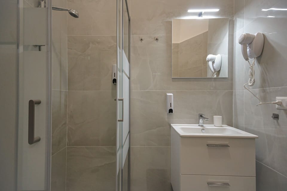 Comfort Triple Room, Balcony | Bathroom | Shower, hair dryer, towels, soap