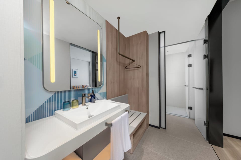 Shower, free toiletries, hair dryer, slippers