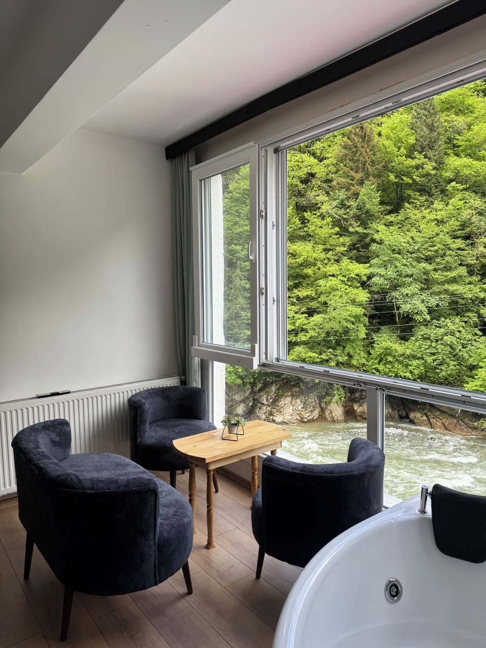 Luxury Condo, River View | Living area | 60-cm Smart TV with cable channels