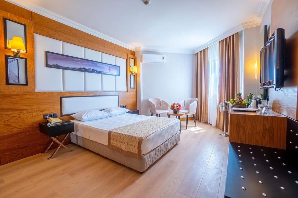 Family Room | Free minibar, in-room safe, desk, laptop workspace